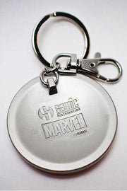Marvel Captain America shield metal keychain angled view in Avengers collector box showing Hulk and Hawkeye